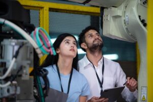 technicians-are-introducing-industrial-hand-robots-businessperson-factory-industry_